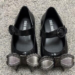 Mini Melissa Black Mary Jane Shoes with Metallic Silver Bow Accent